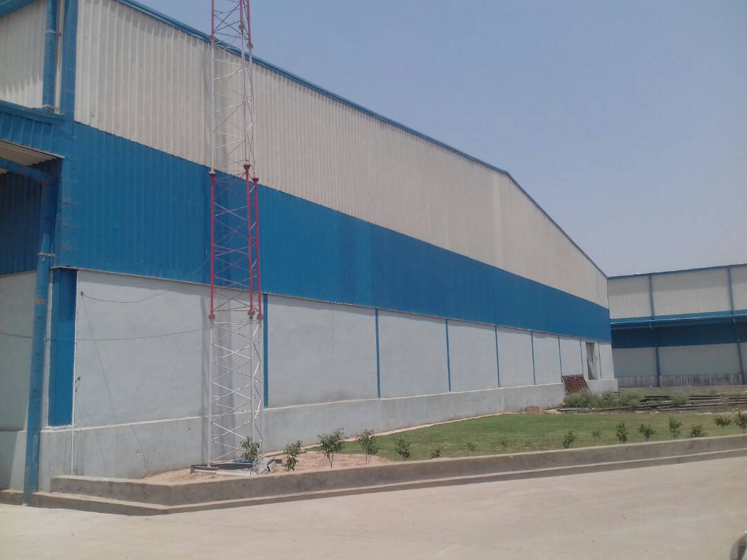 Exterior Side View of DHDL India Warehouse PEB Structure